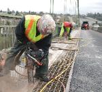 ICS 680GC Concrete Chainsaw Plunge Cutting on the Tacoma Narrows Bridge in Washington State.